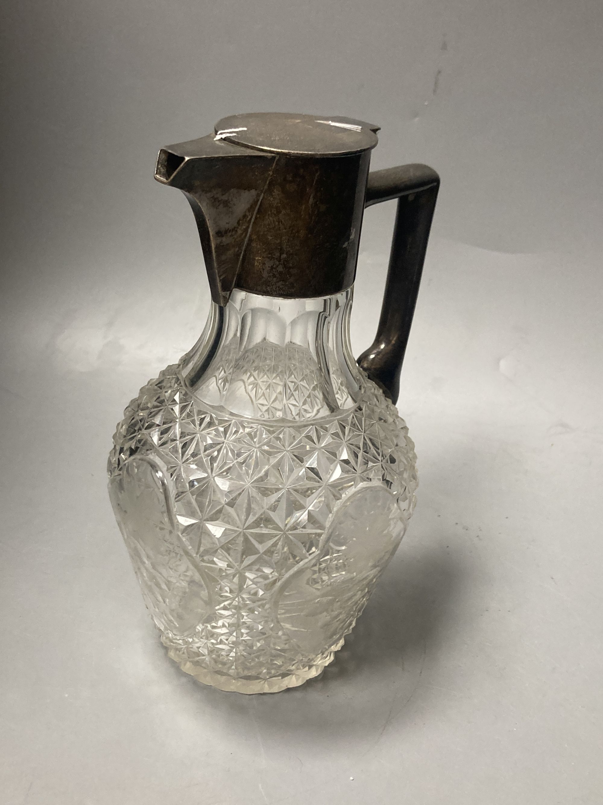 An Edwardian silver mounted cut glass claret jug, Walker & Hall, Sheffield, 1905, 21.7cm, a.f.